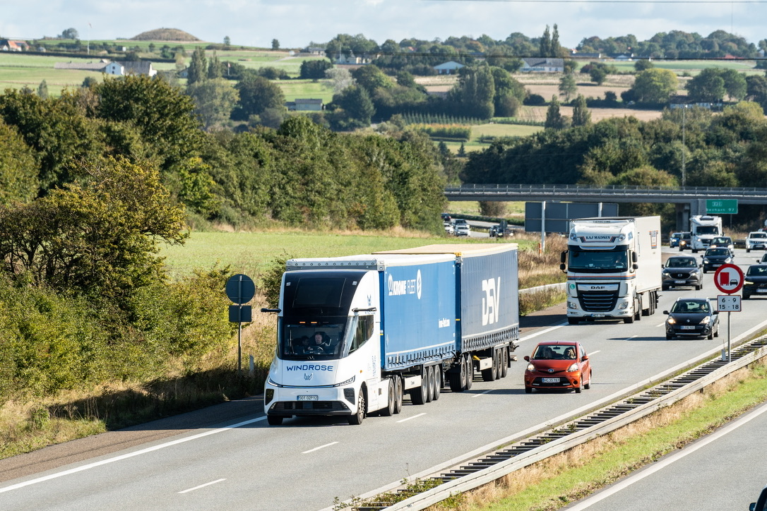 Windrose double trailer with Krone and DSV trailers on a highway